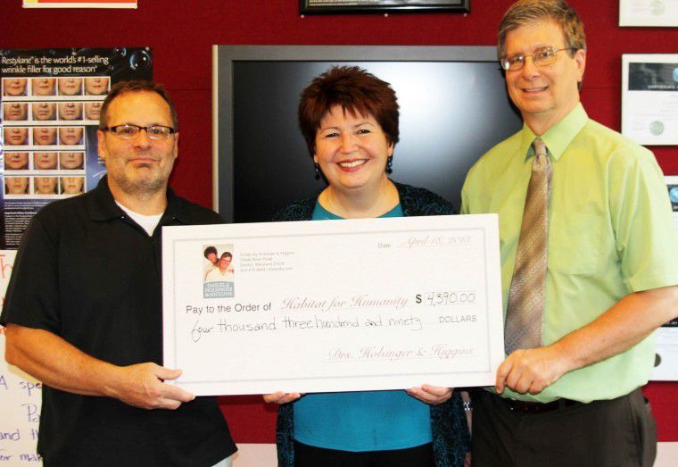 Denton dental office donates to Caroline Habitat for Humanity